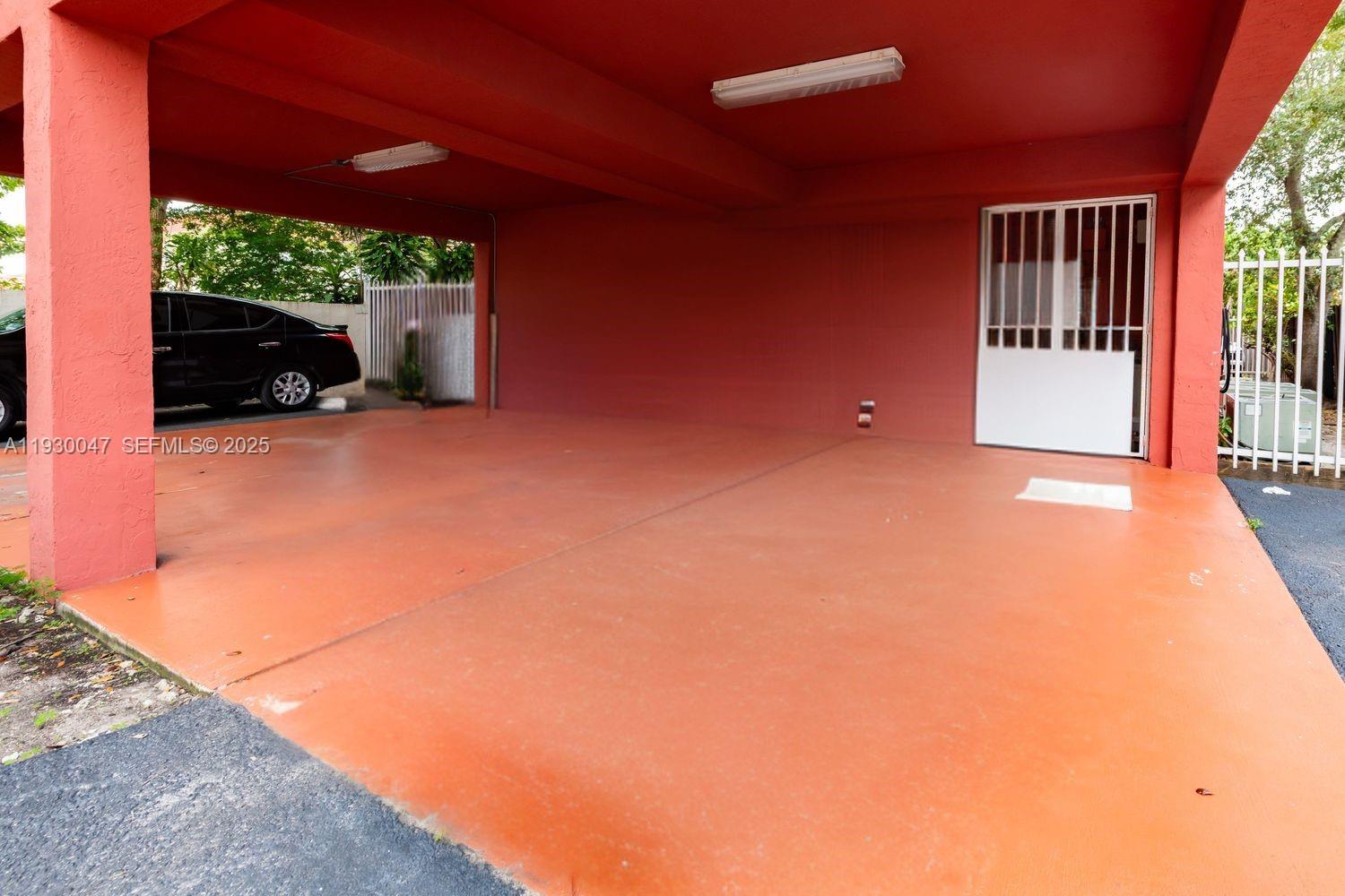 63 Northwest 17th Place, Unit 6 Miami, FL 33125 - Photo 24 of 25 a view of a porch with furniture and floor to ceiling window