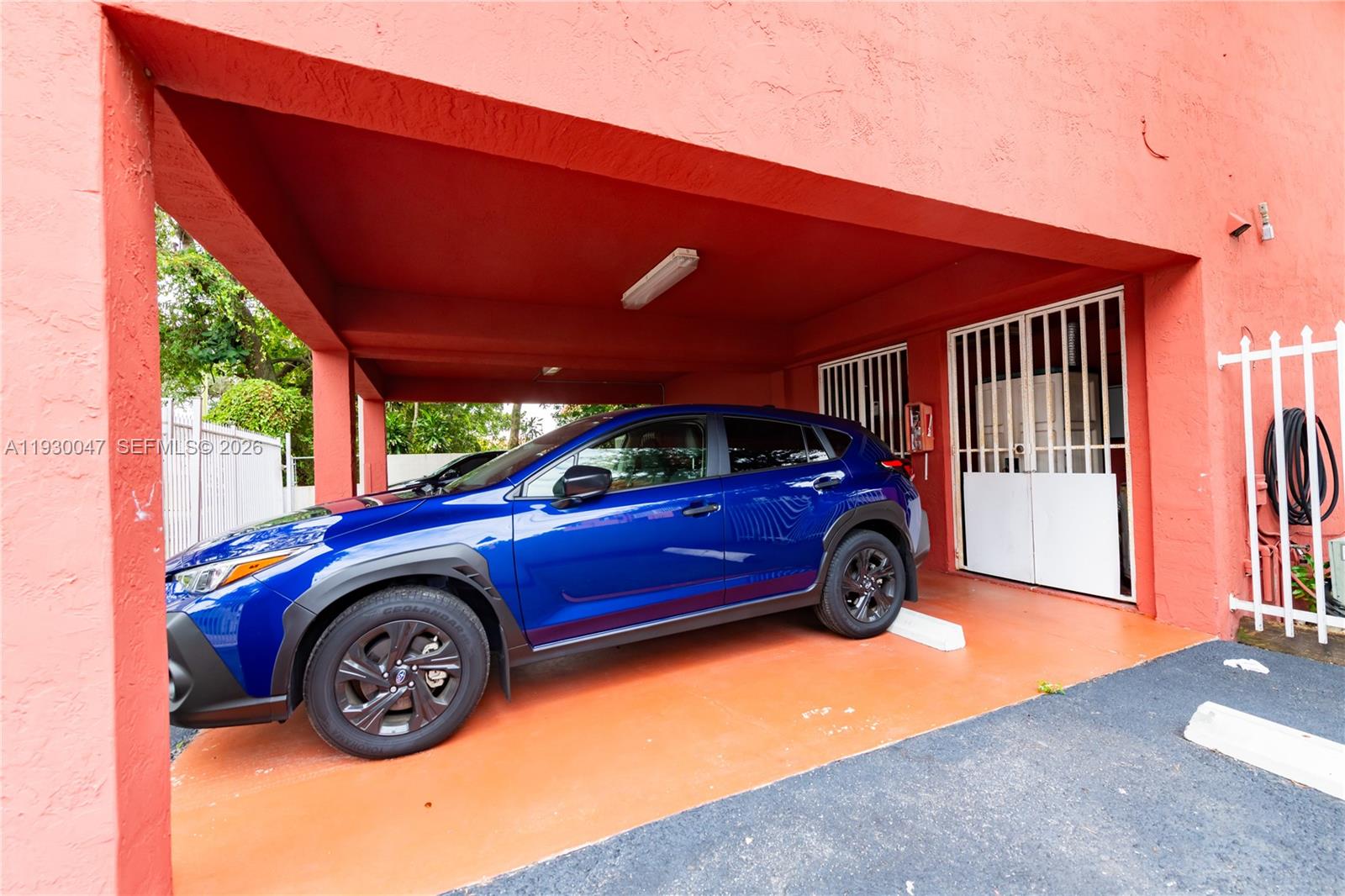 63 Northwest 17th Place, Unit 6 Miami, FL 33125 - Photo 24 of 24 a view of a car in front of house