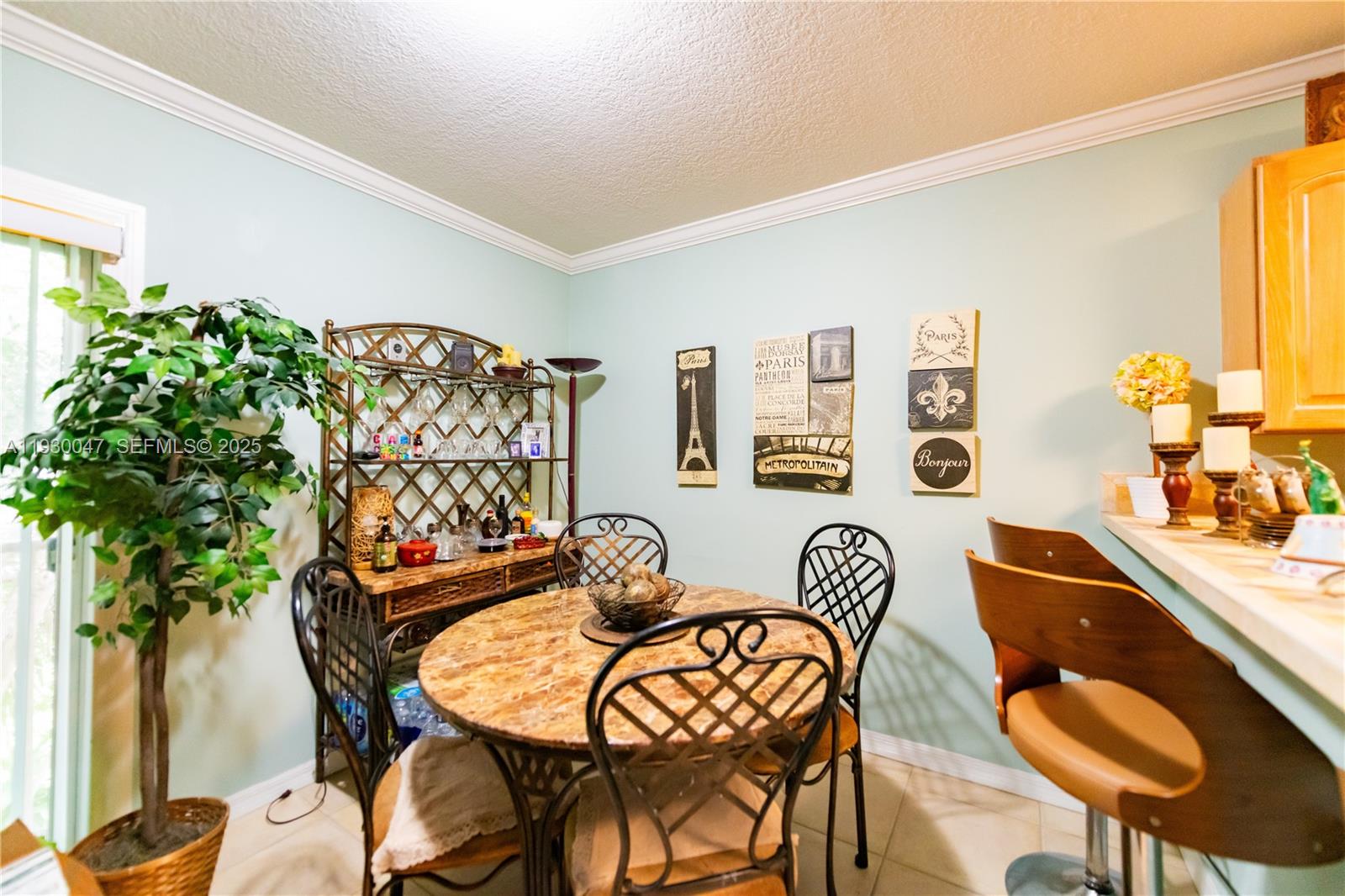 63 Northwest 17th Place, Unit 6 Miami, FL 33125 - Photo 9 of 25 a dining room with furniture and wooden floor