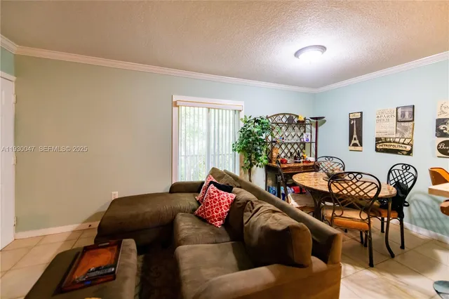 a bedroom with furniture and a flat screen tv