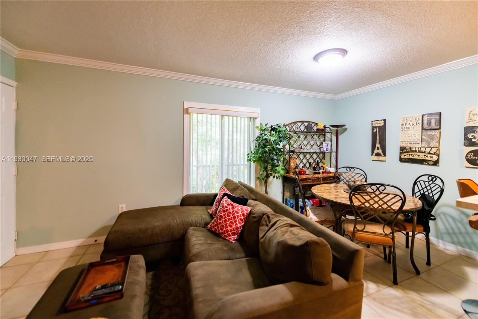 63 Northwest 17th Place, Unit 6 Miami, FL 33125 - Photo 10 of 25 a living room with furniture and wooden floor