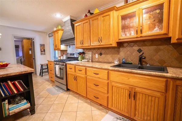 a kitchen with sink cabinets and appliances