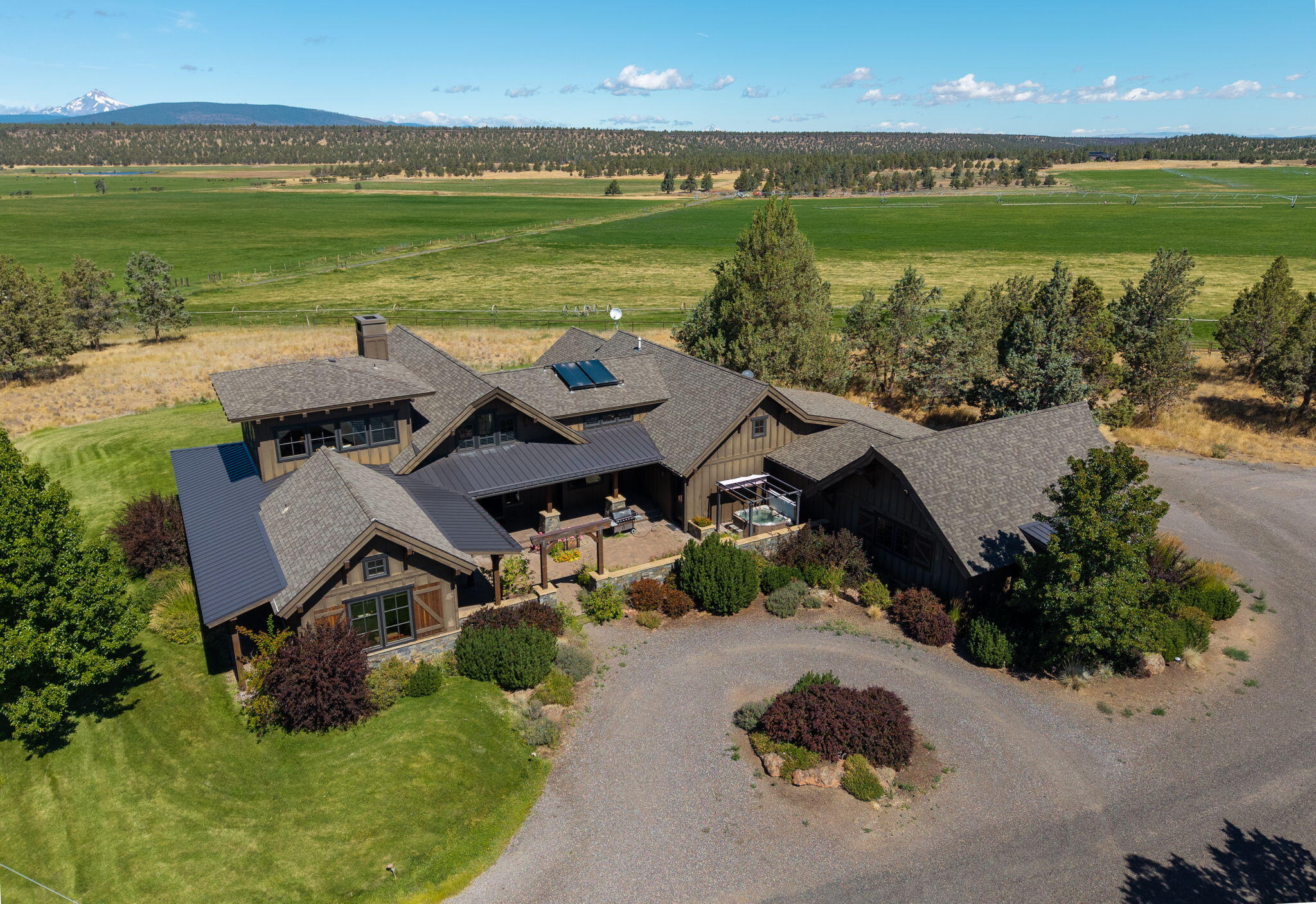 71285 Holmes Road Sisters, OR 97759 - Photo 1 of 123 an aerial view of a house with a garden and lake view