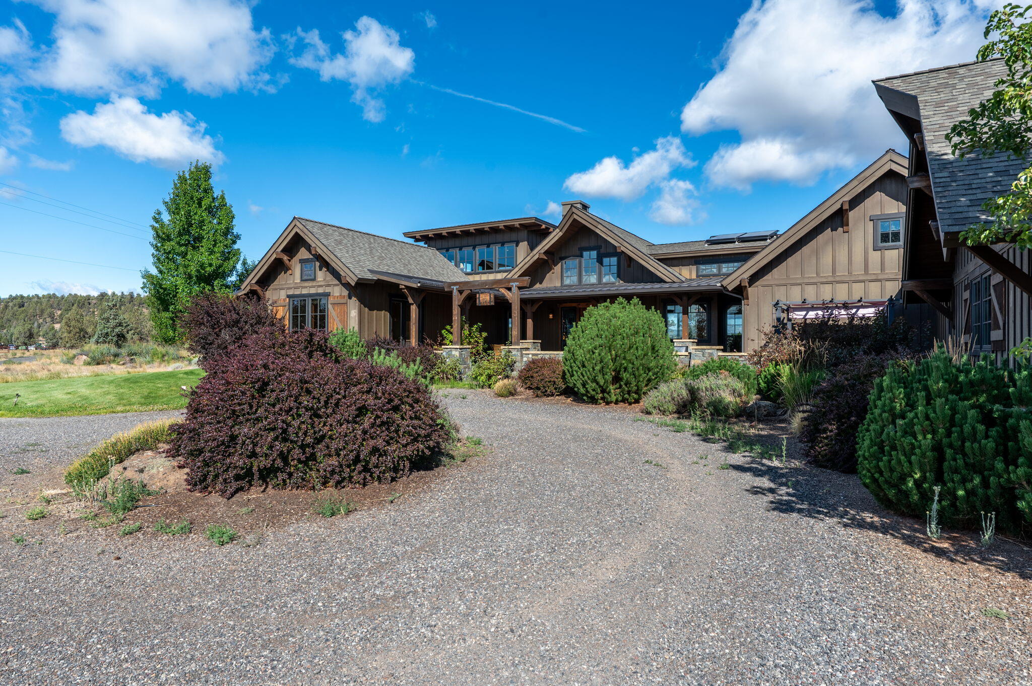 71285 Holmes Road Sisters, OR 97759 - Photo 104 of 123 a front view of a house with a yard and outdoor seating