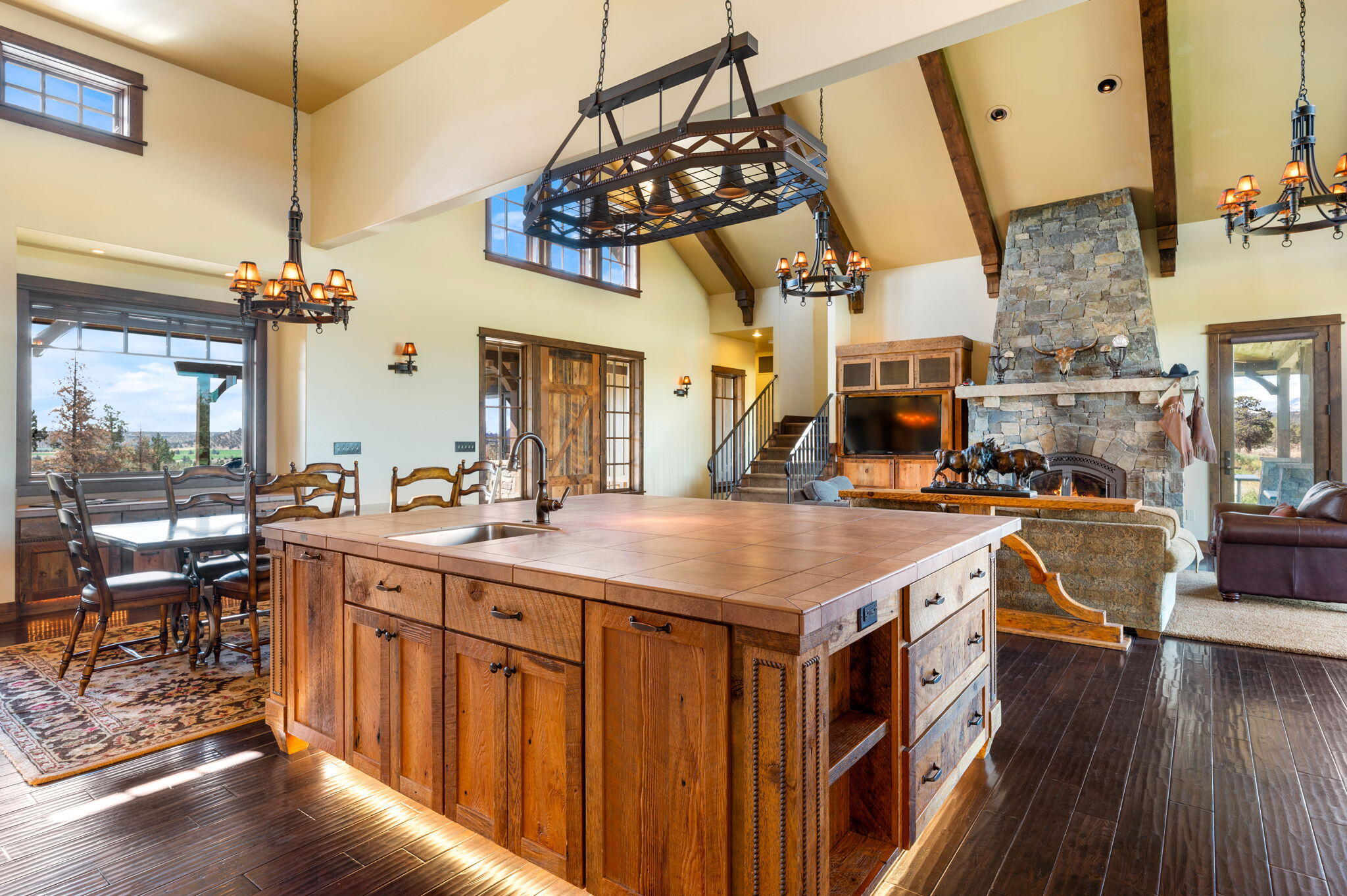 71285 Holmes Road Sisters, OR 97759 - Photo 13 of 123 a kitchen that has a lot of cabinets and wooden floor