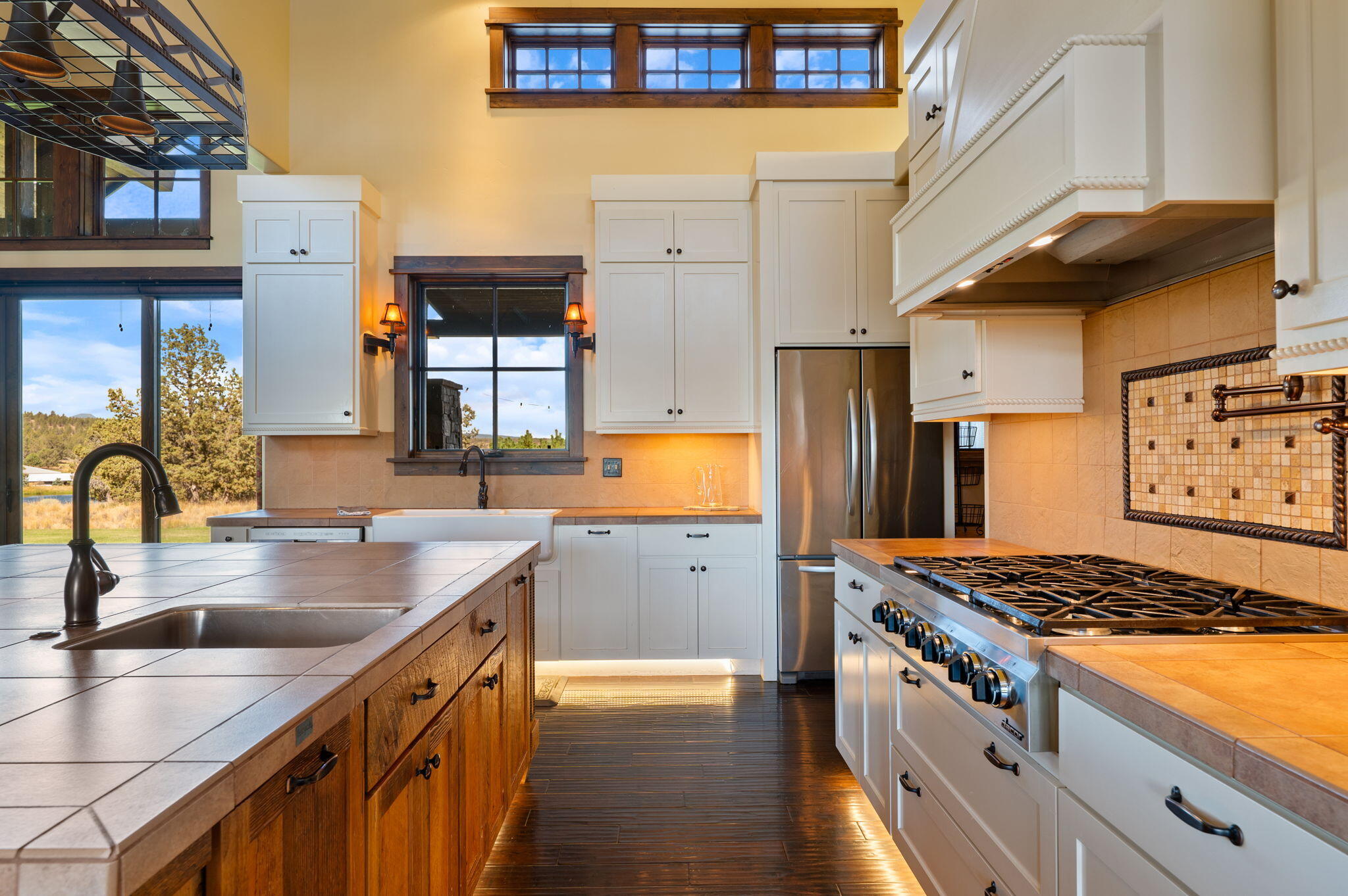 71285 Holmes Road Sisters, OR 97759 - Photo 19 of 123 a kitchen with stainless steel appliances granite countertop a sink stove and refrigerator
