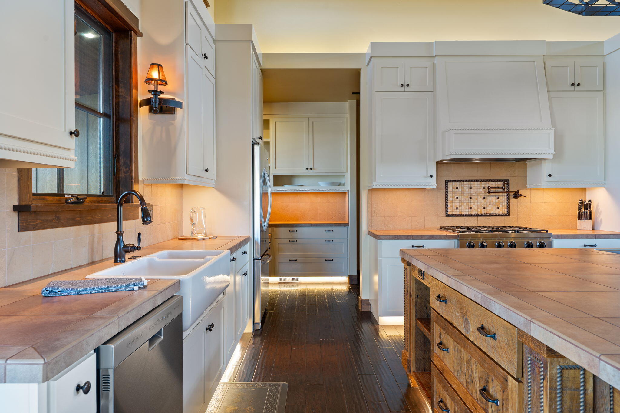71285 Holmes Road Sisters, OR 97759 - Photo 20 of 123 a kitchen with a sink stove and cabinets