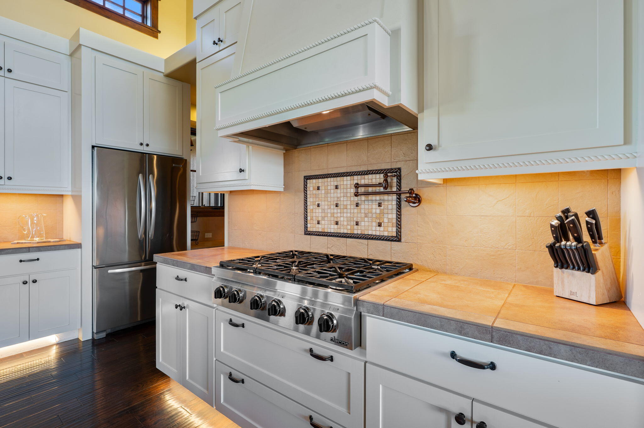 71285 Holmes Road Sisters, OR 97759 - Photo 21 of 123 a kitchen with stainless steel appliances granite countertop a sink stove and refrigerator