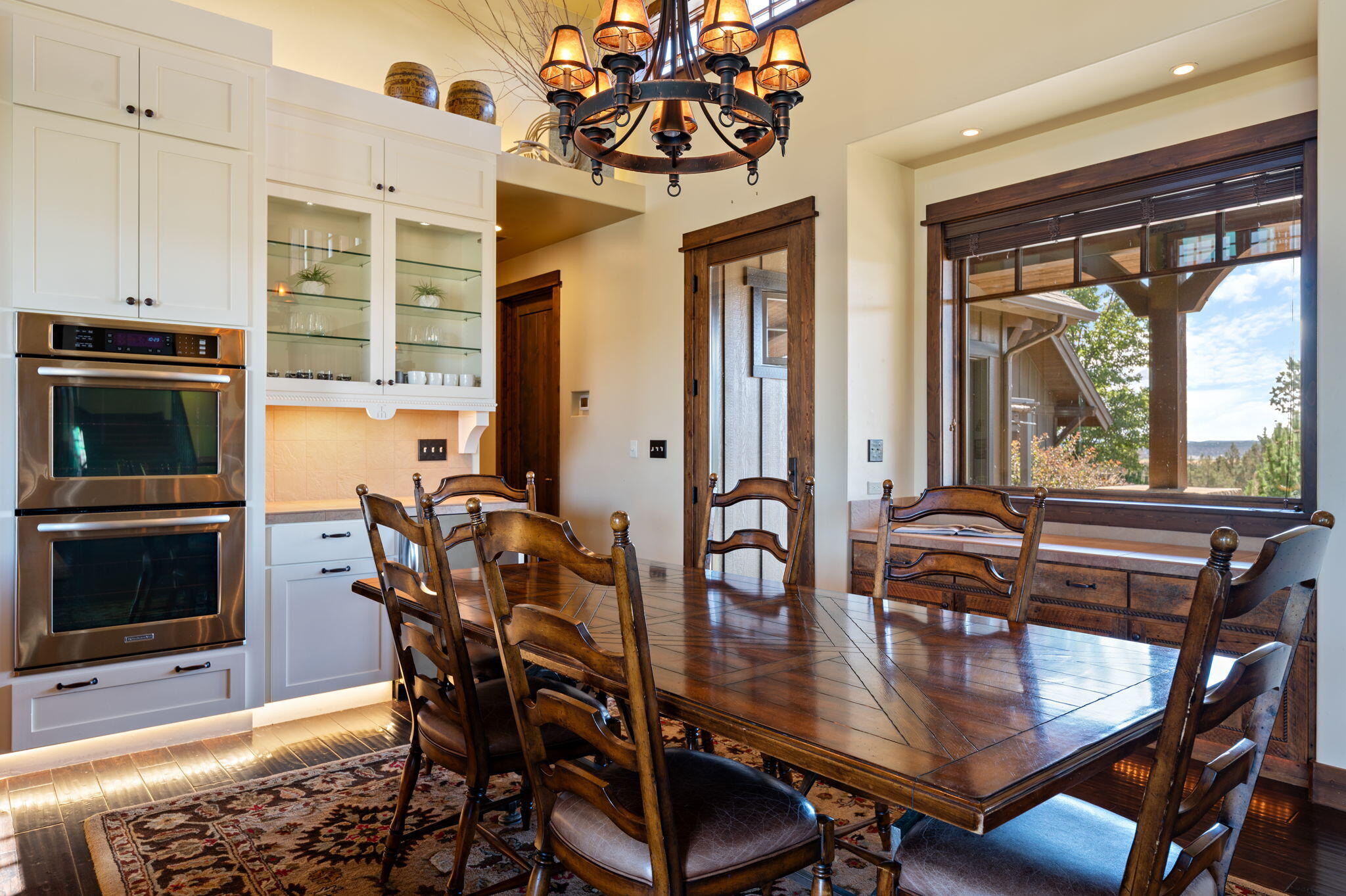 71285 Holmes Road Sisters, OR 97759 - Photo 25 of 123 a view of a dining room with furniture window and wooden floor