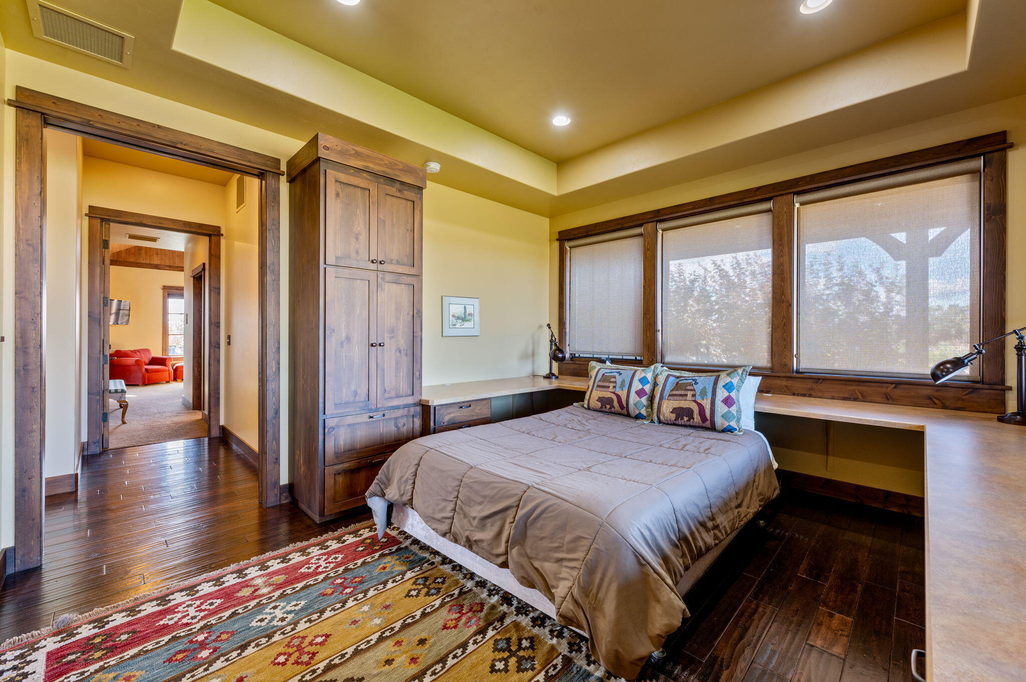 71285 Holmes Road Sisters, OR 97759 - Photo 35 of 123 a bedroom with a bed and a large window with outer view