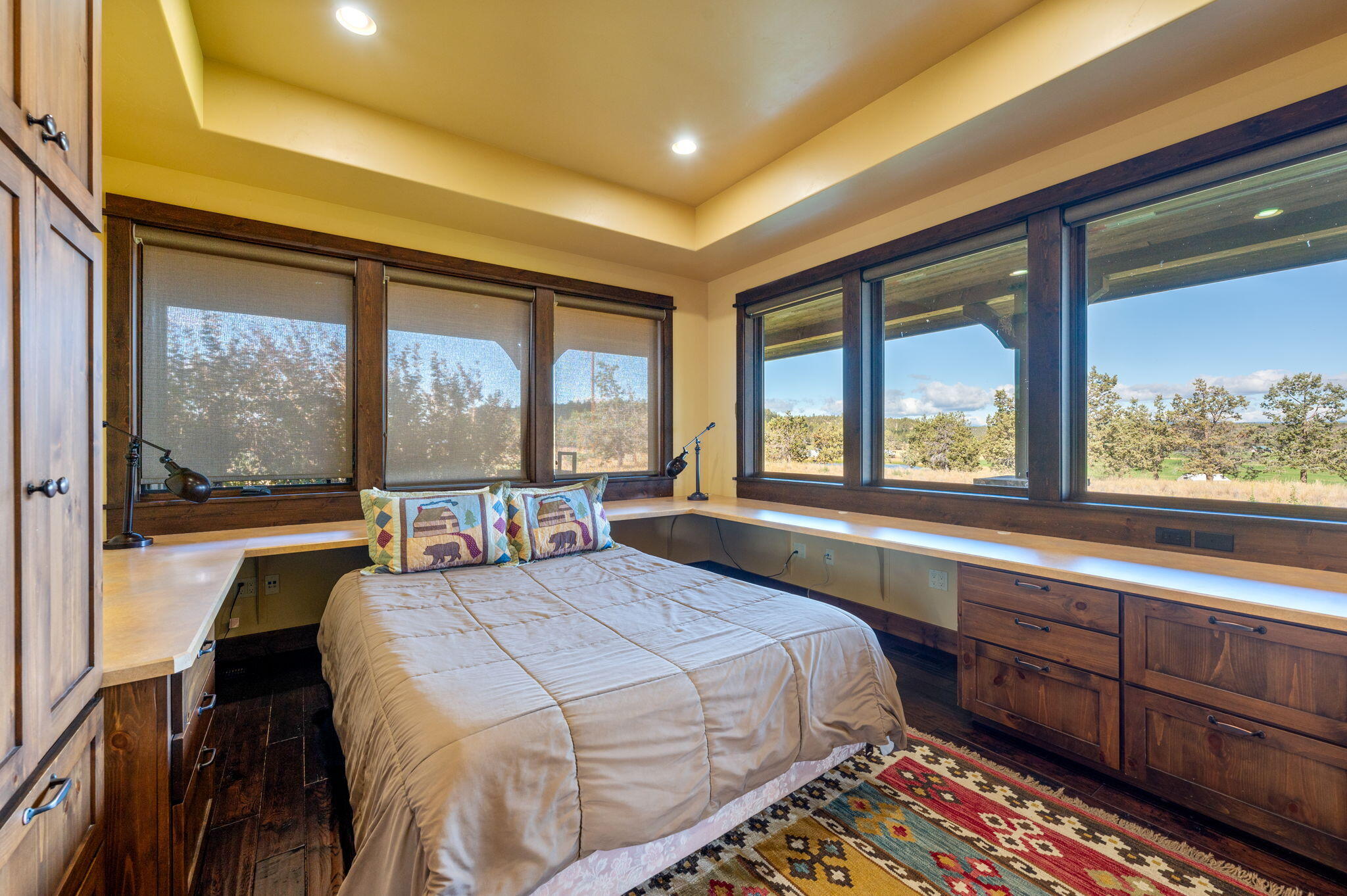 71285 Holmes Road Sisters, OR 97759 - Photo 36 of 123 a bedroom with a large bed and a large window with outer view