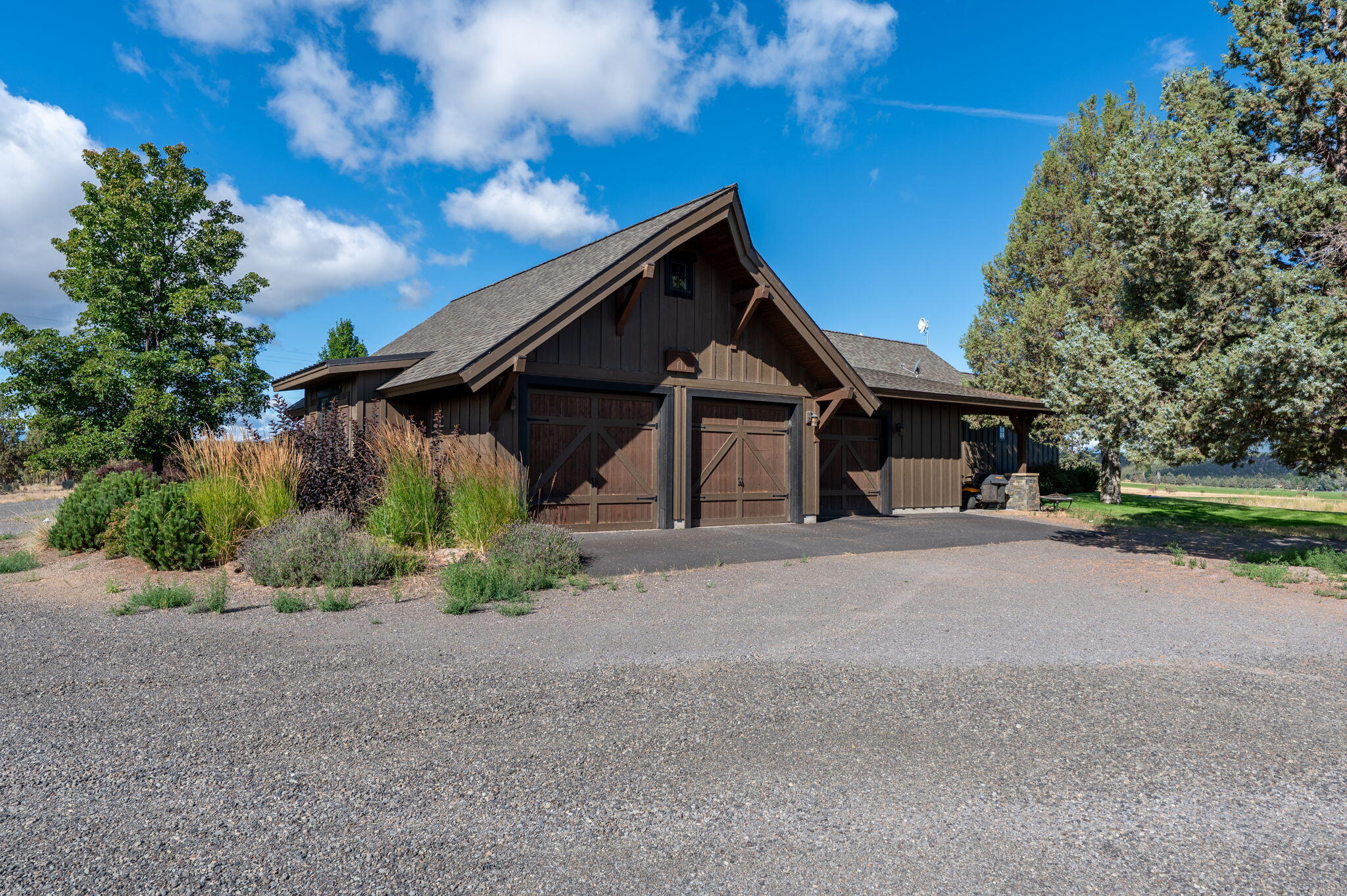 71285 Holmes Road Sisters, OR 97759 - Photo 79 of 123 a front view of a house with a yard and garage