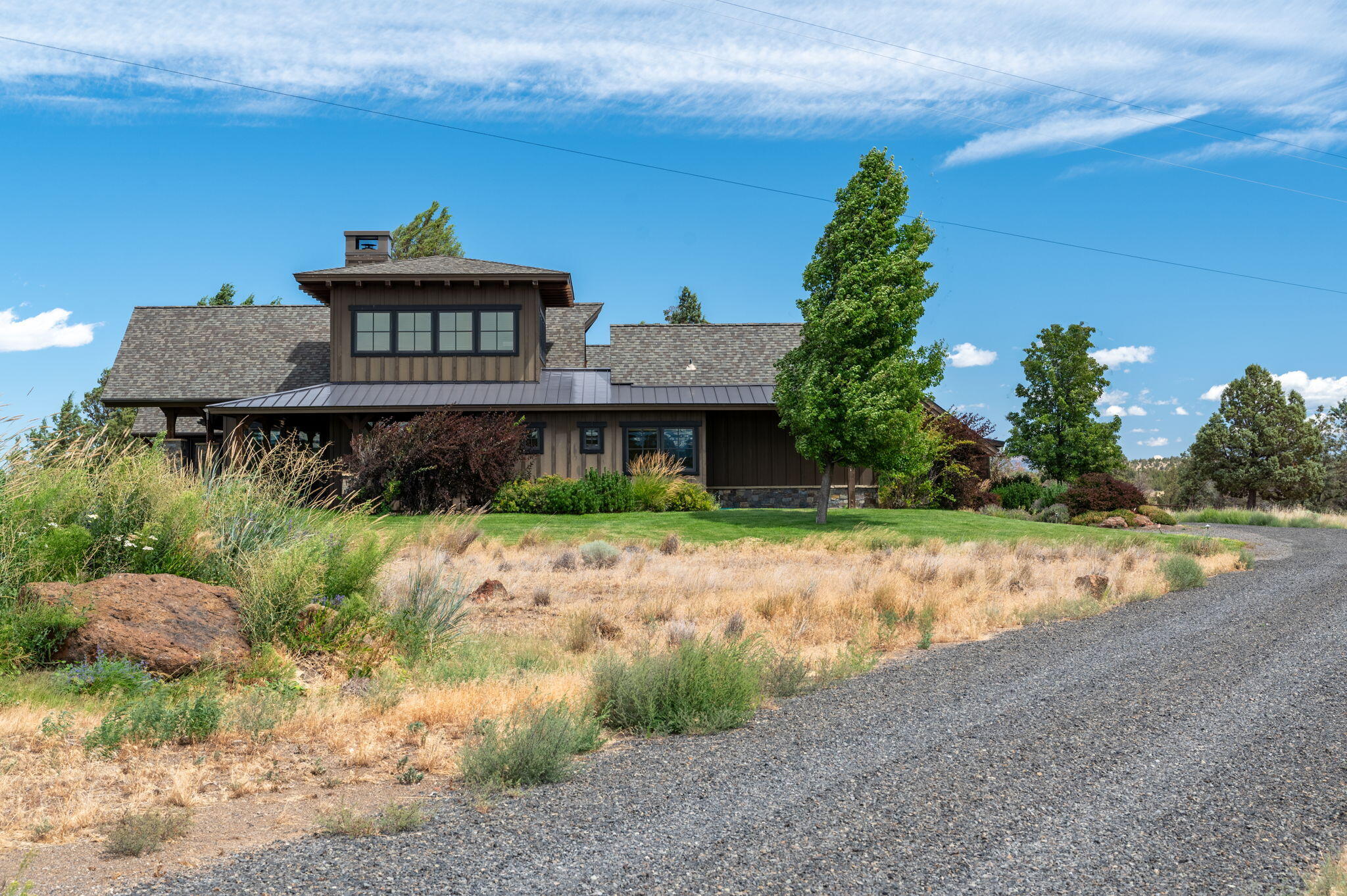 71285 Holmes Road Sisters, OR 97759 - Photo 98 of 123 a view of a house with a yard and potted plants