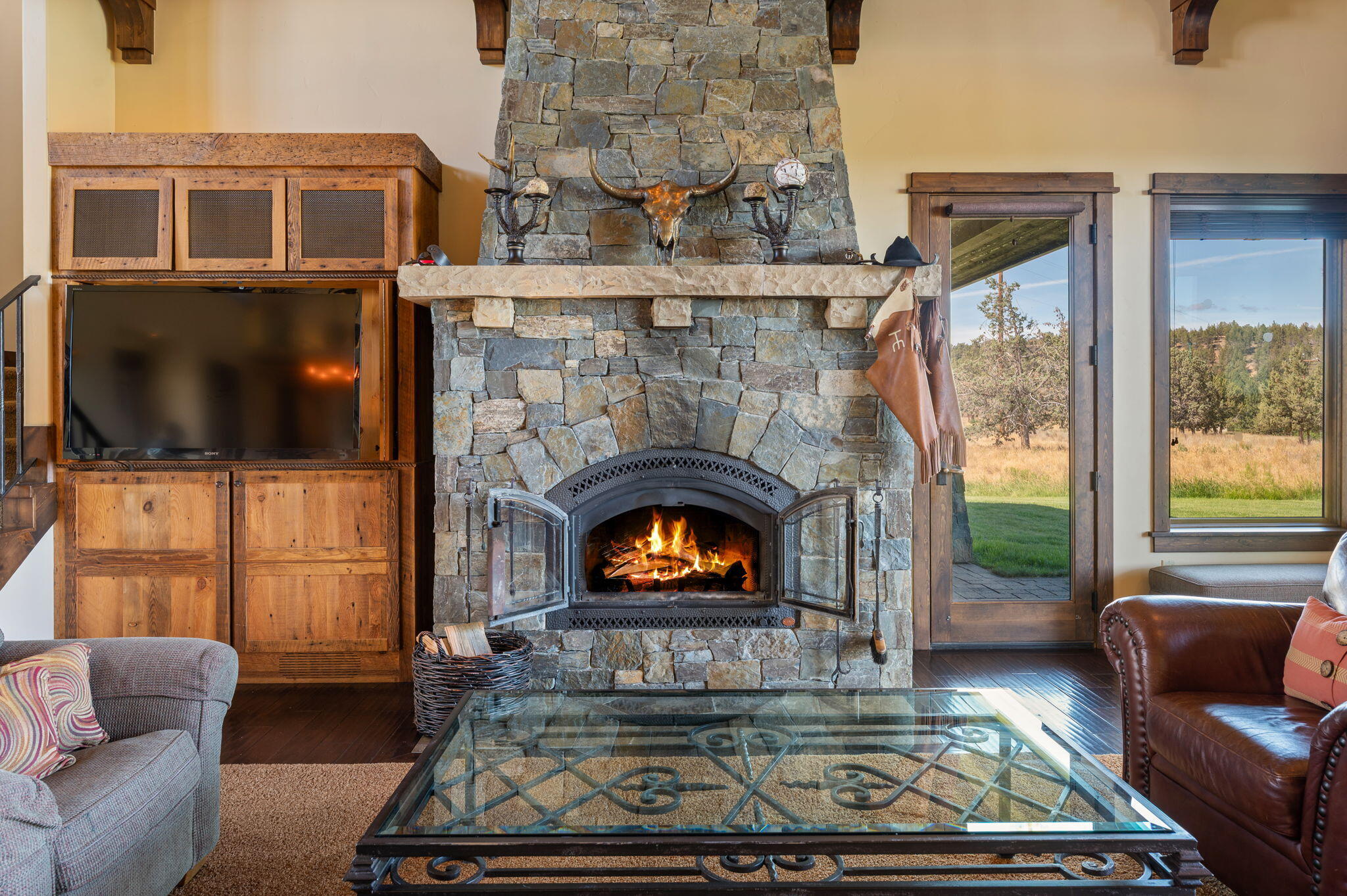 71285 Holmes Road Sisters, OR 97759 - Photo 10 of 123 a living room with furniture fireplace and flat screen tv