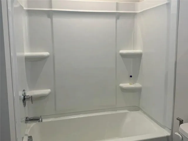 a bedroom with a bed and a closet