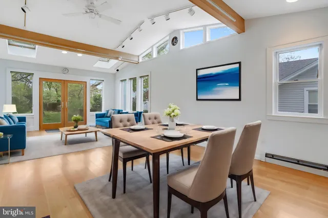 a view of a dining room with furniture window and wooden floor
