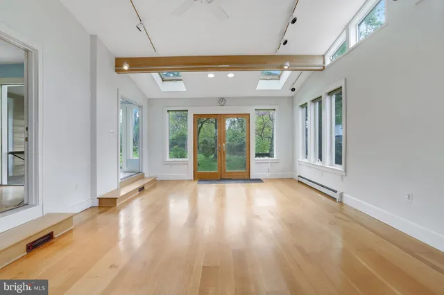 a view of an entryway with wooden floor