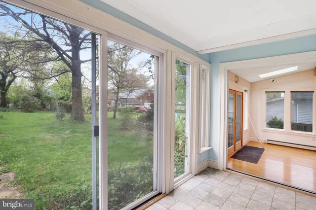 a room with a large window and a yard