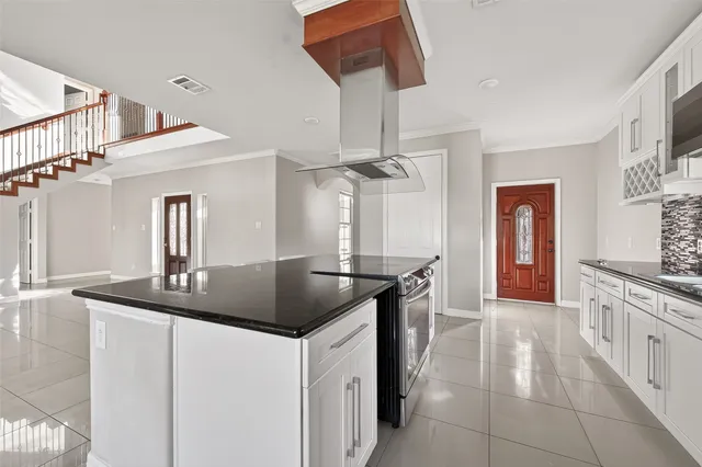 a kitchen with stainless steel appliances granite countertop a sink and cabinets