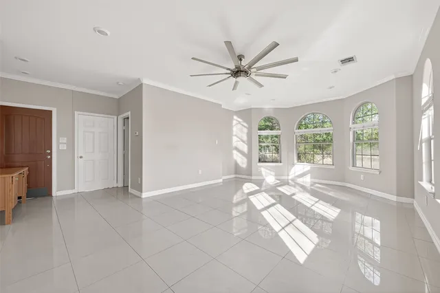 a living room with furniture and white walls