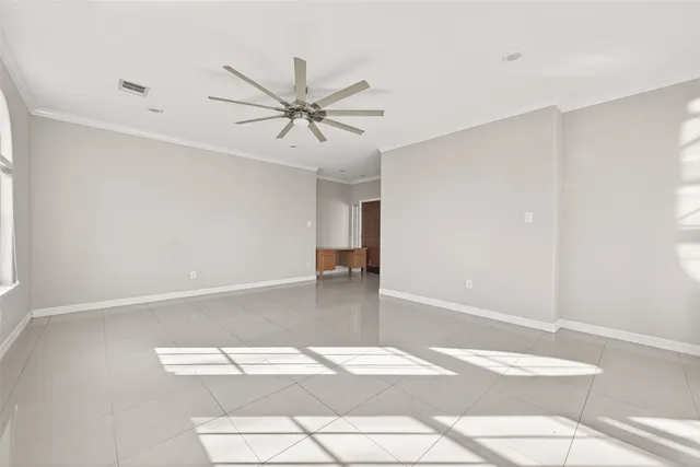 a view of a hallway with wooden floor and windows