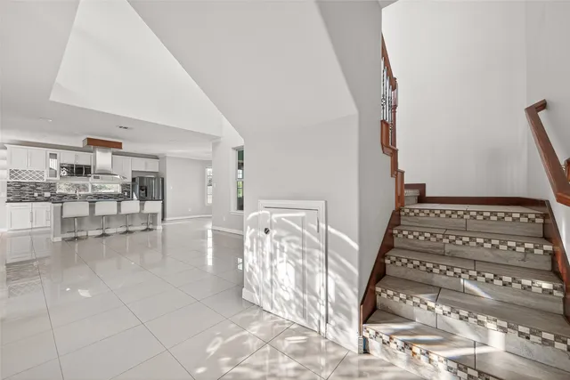 a view of an entryway with wooden floor