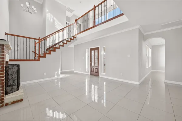 a view of entryway and hall with a wooden floor