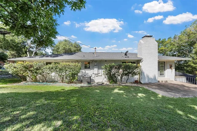 a view of a park with large trees