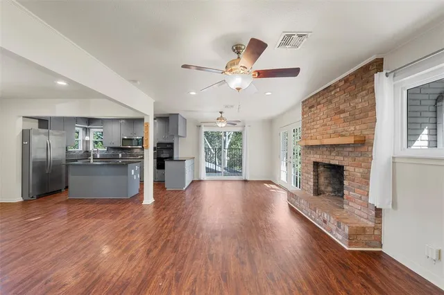 a view of a kitchen with a stove cabinets and wooden floor
