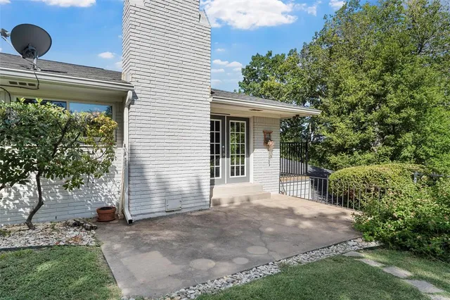 a view of a big room with a big yard and potted plants