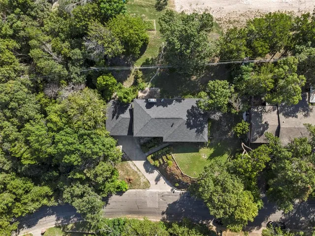 a view of a house with a yard porch and sitting area