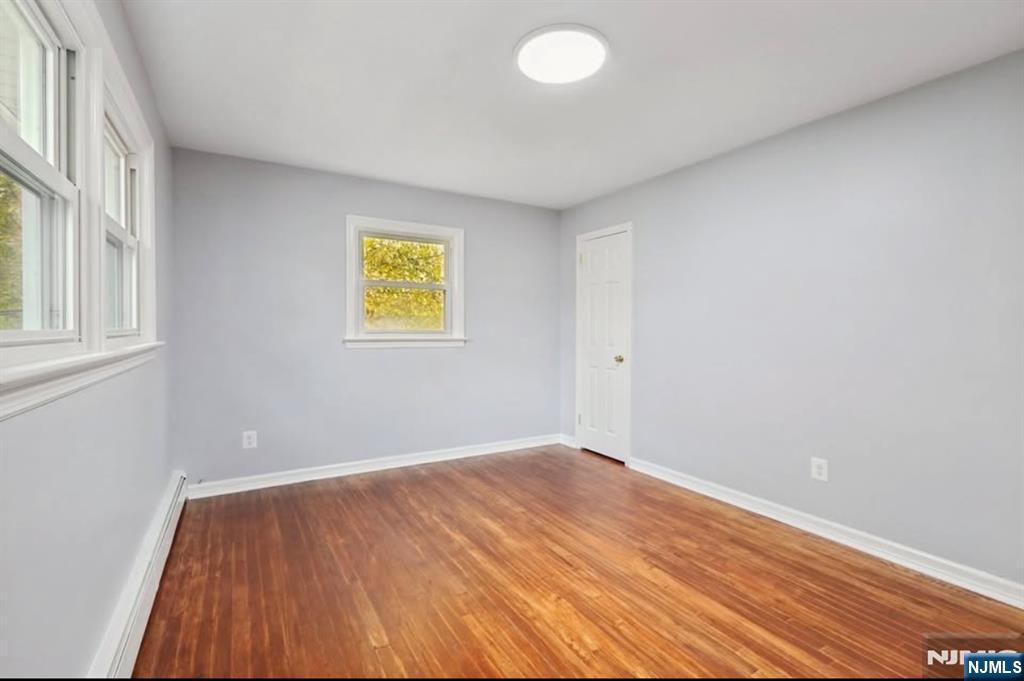 162 East Fairmount Avenue, Unit 2 Maywood, NJ 07607 - Photo 15 of 21 wooden floor in an empty room with a window