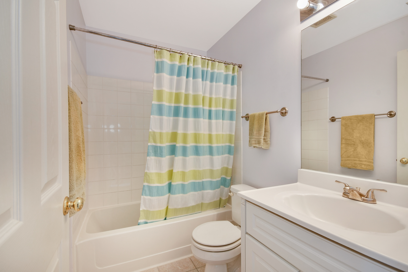 8211 Ripple Ridge Darien, IL 60561 - Photo 15 of 17 a bathroom with a sink a toilet and shower