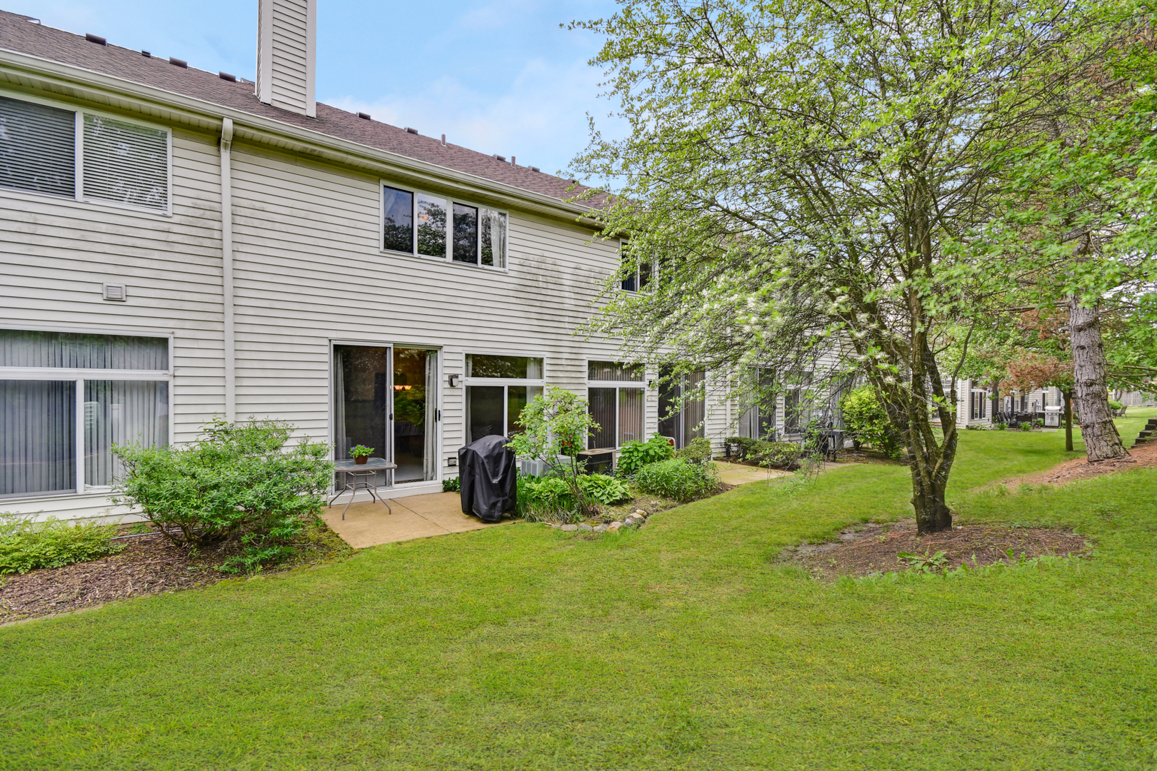 8211 Ripple Ridge Darien, IL 60561 - Photo 17 of 17 a front view of a house with garden and trees