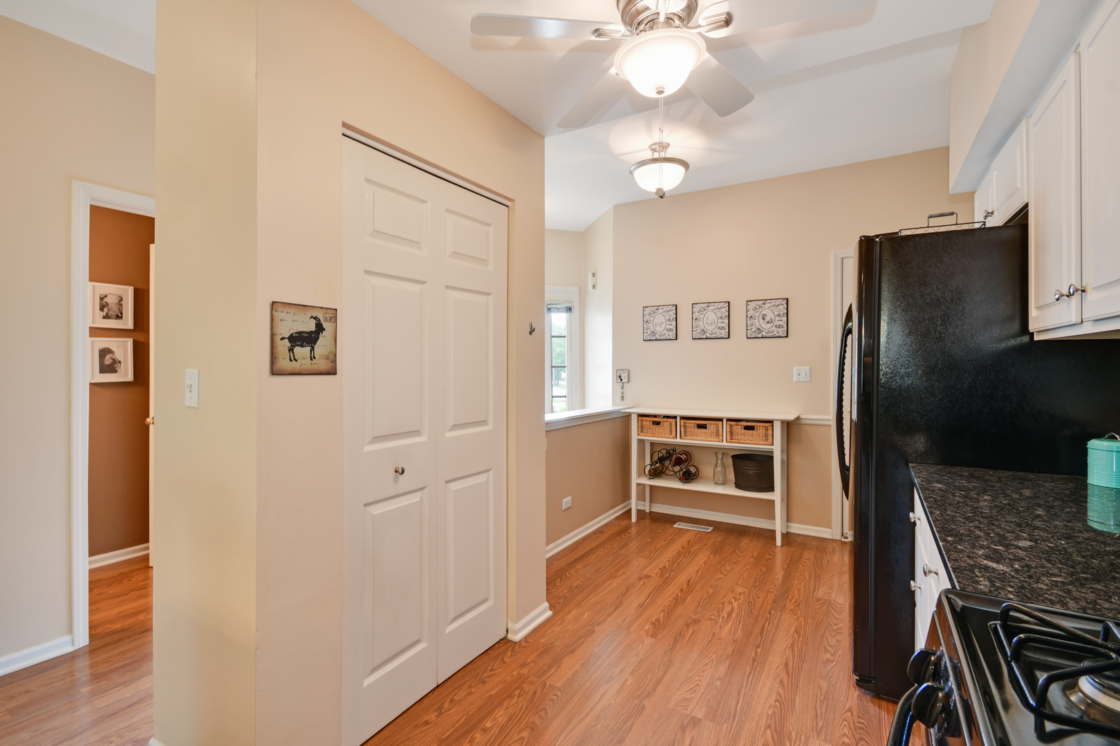 8211 Ripple Ridge Darien, IL 60561 - Photo 4 of 17 a kitchen with a refrigerator and a stove top oven