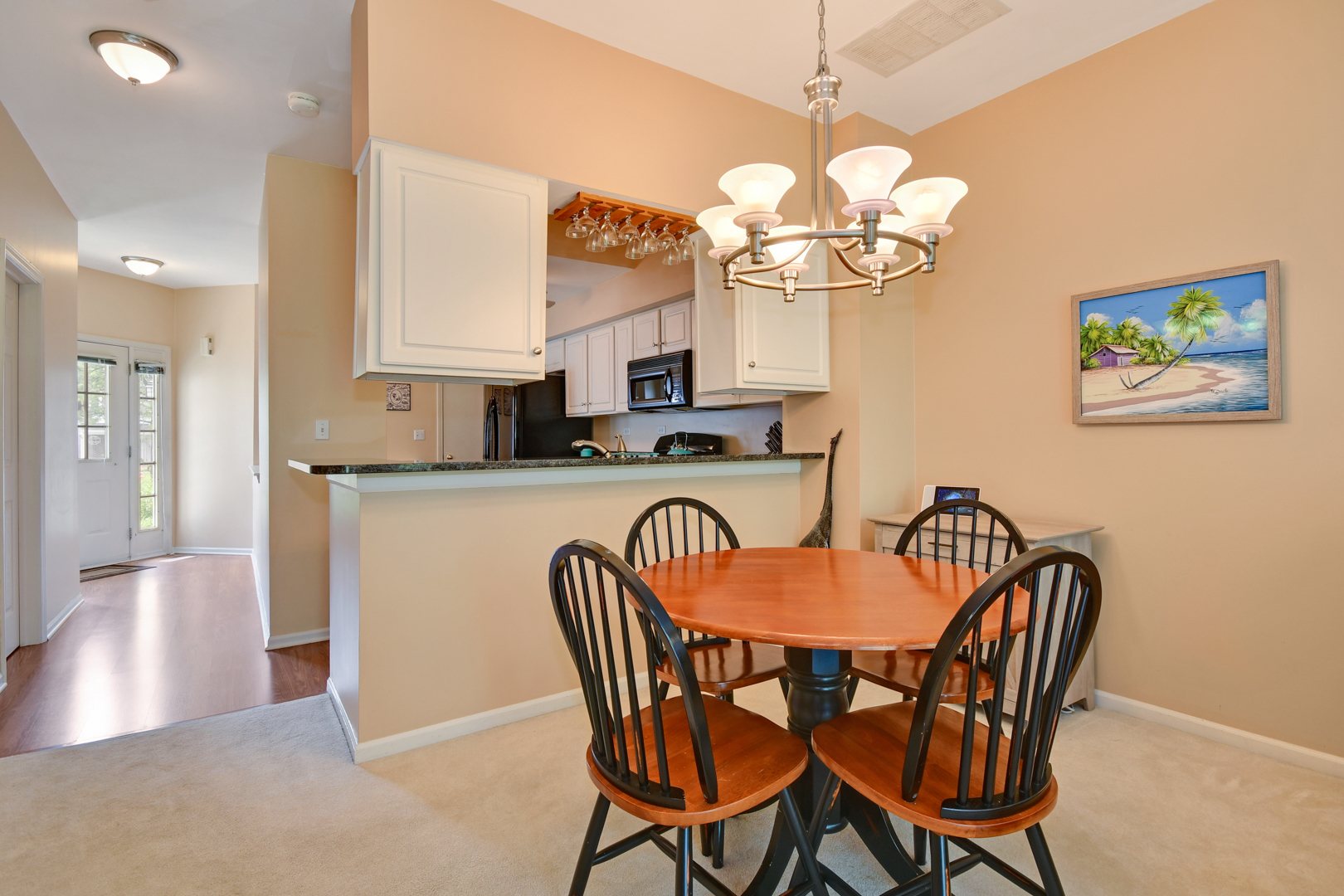 8211 Ripple Ridge Darien, IL 60561 - Photo 6 of 17 a dining room filled chandelier and a dining table