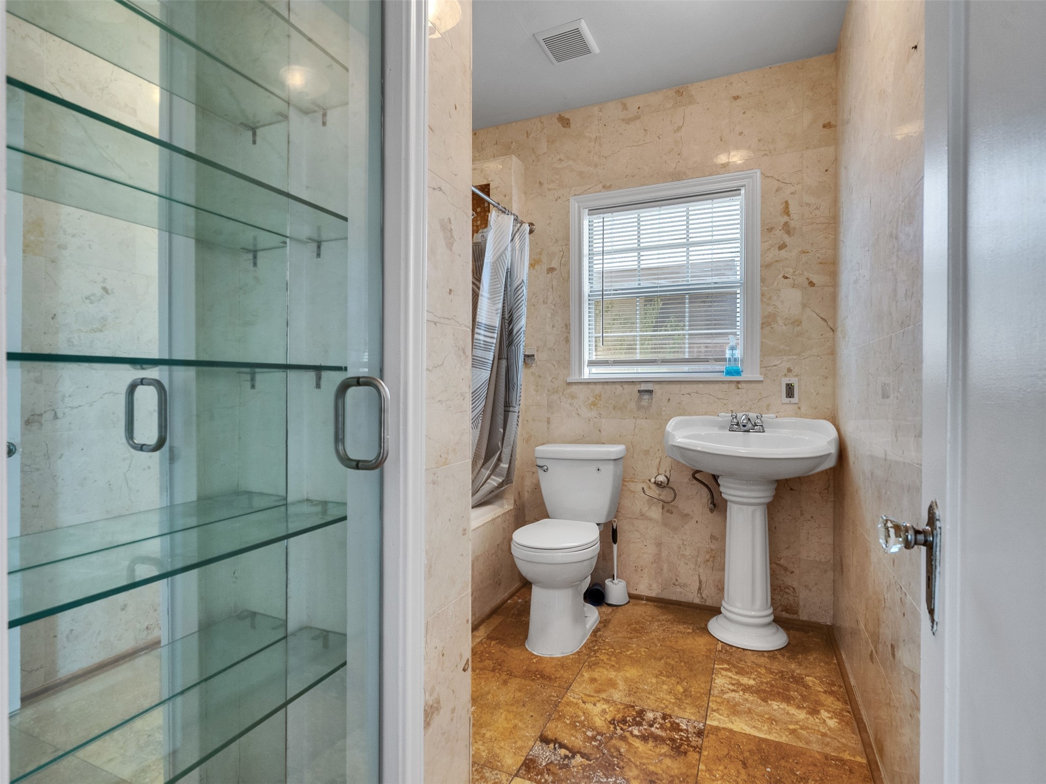 2141 Colquitt Street Houston, TX 77098 - Photo 14 of 50 a bathroom with a sink toilet and shower