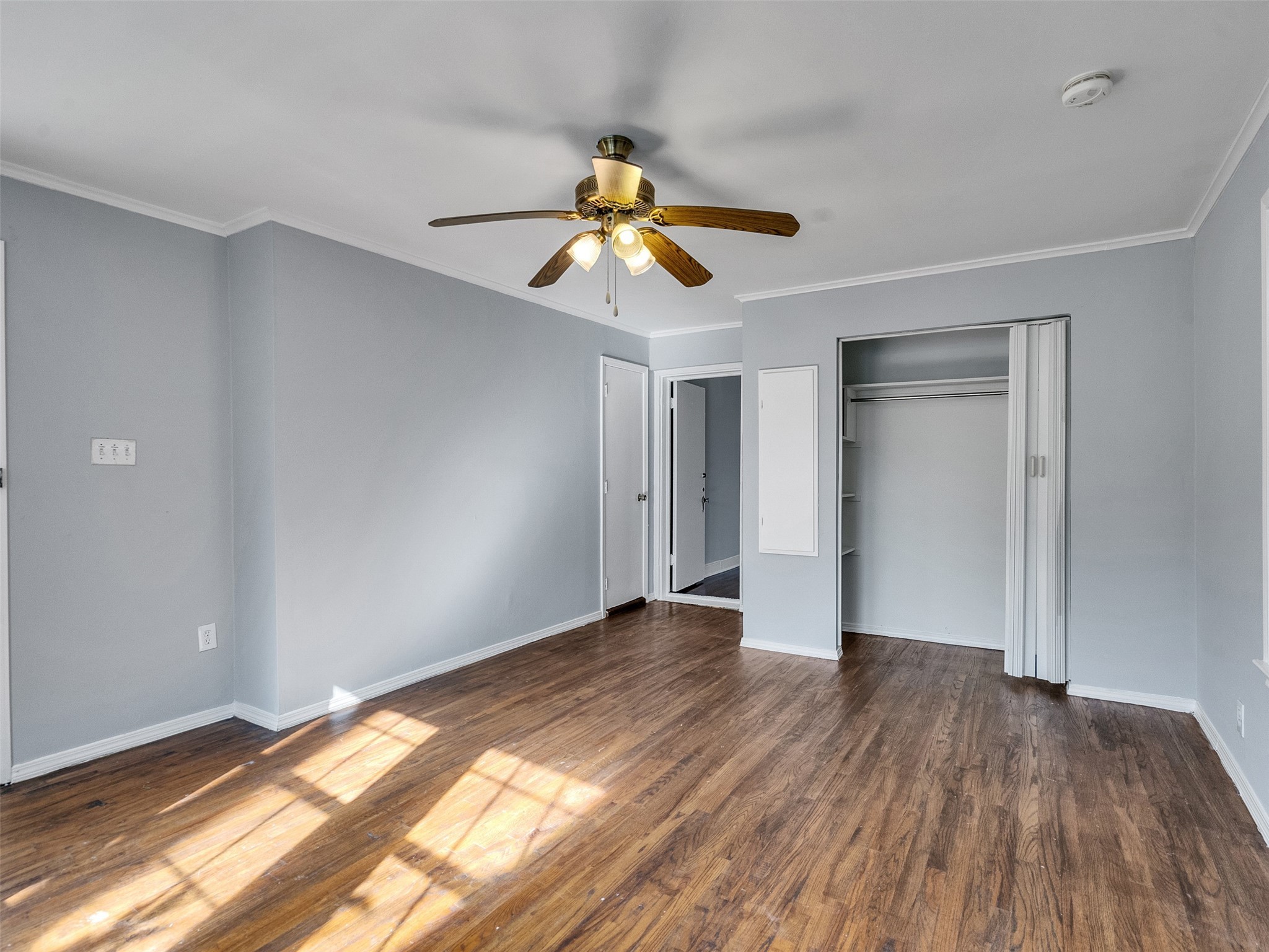2141 Colquitt Street Houston, TX 77098 - Photo 20 of 50 a view of empty room with wooden floor and fan