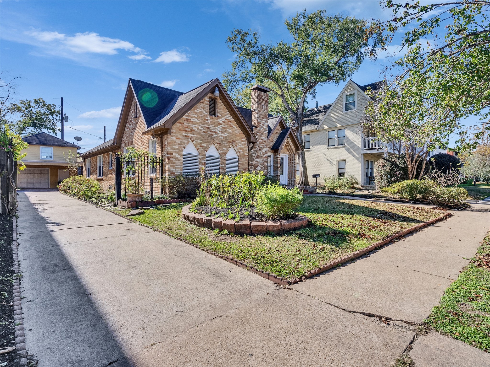 2141 Colquitt Street Houston, TX 77098 - Photo 2 of 50 a front view of a house with a yard and garage