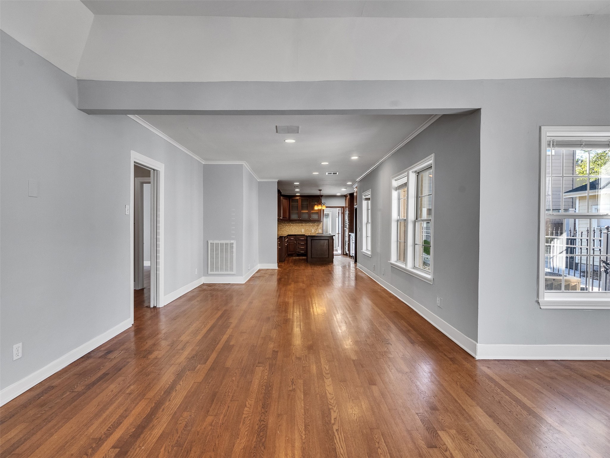 2141 Colquitt Street Houston, TX 77098 - Photo 27 of 50 a view of empty room with wooden floor and windows