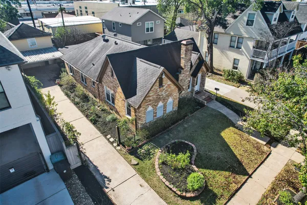 a aerial view of a house with large trees