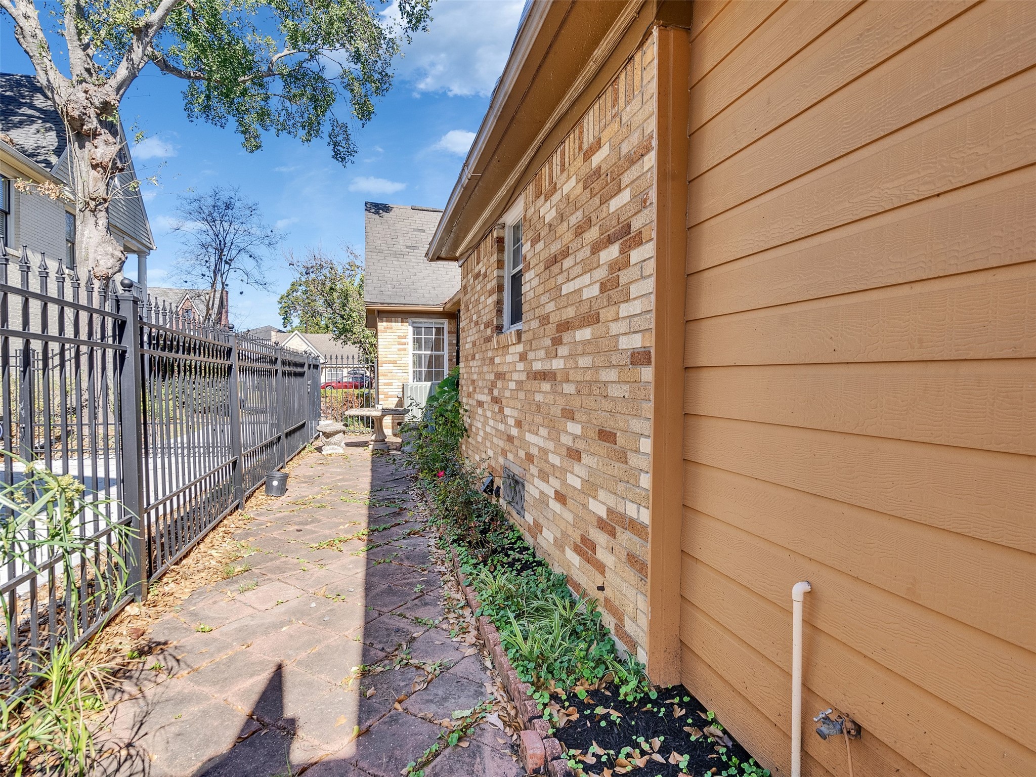 2141 Colquitt Street Houston, TX 77098 - Photo 38 of 50 a view of a pathway both side of house