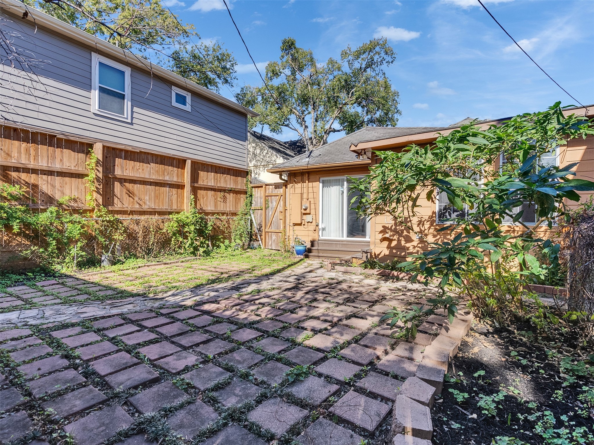 2141 Colquitt Street Houston, TX 77098 - Photo 41 of 50 a view of a house with a small yard and plants
