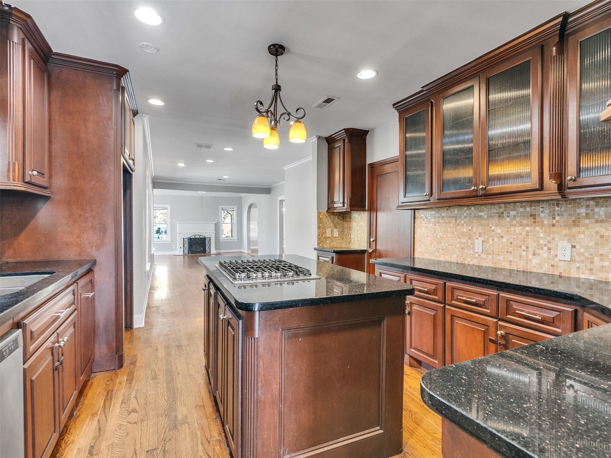 2141 Colquitt Street Houston, TX 77098 - Photo 10 of 50 a kitchen with granite countertop kitchen island stainless steel appliances a sink stove and cabinets