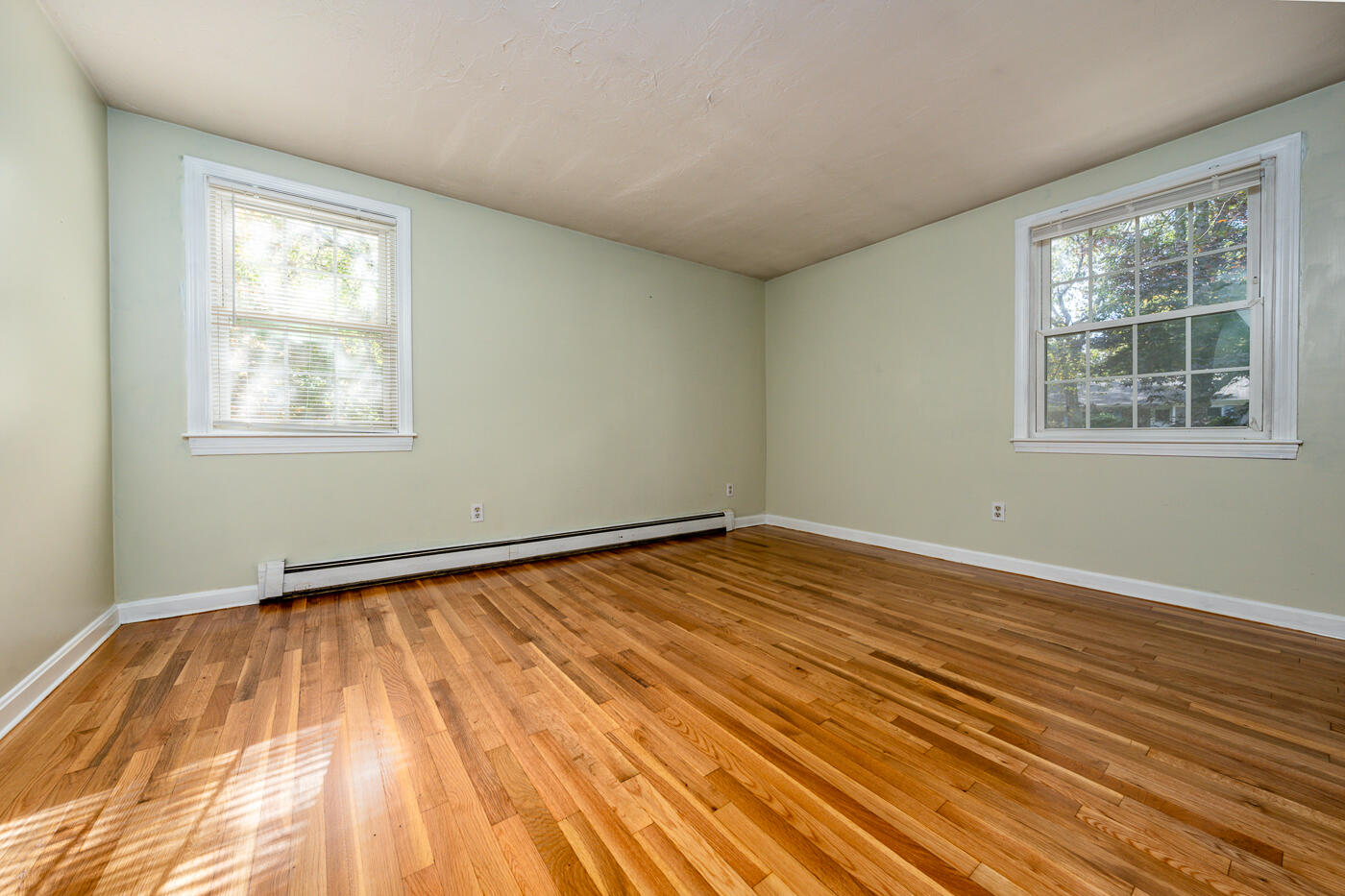 40 Goose Point Road Centerville, MA 02601 - Photo 10 of 30 a view of an empty room with wooden floor and a window