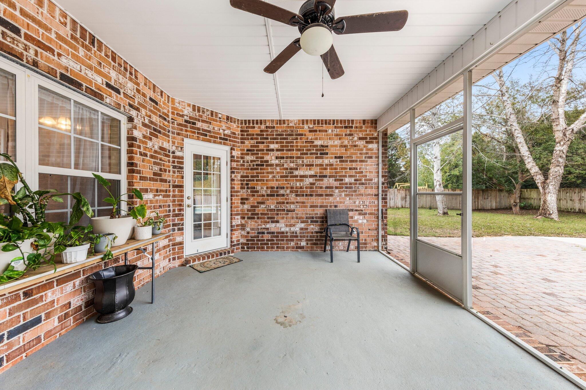 901 Shoal River Drive Crestview, FL 32539 - Photo 11 of 56 a very nice looking room with a large window and chandelier