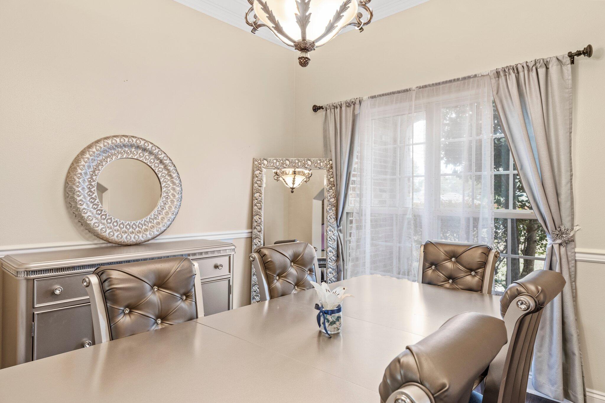 901 Shoal River Drive Crestview, FL 32539 - Photo 16 of 56 a living room with furniture and a large window