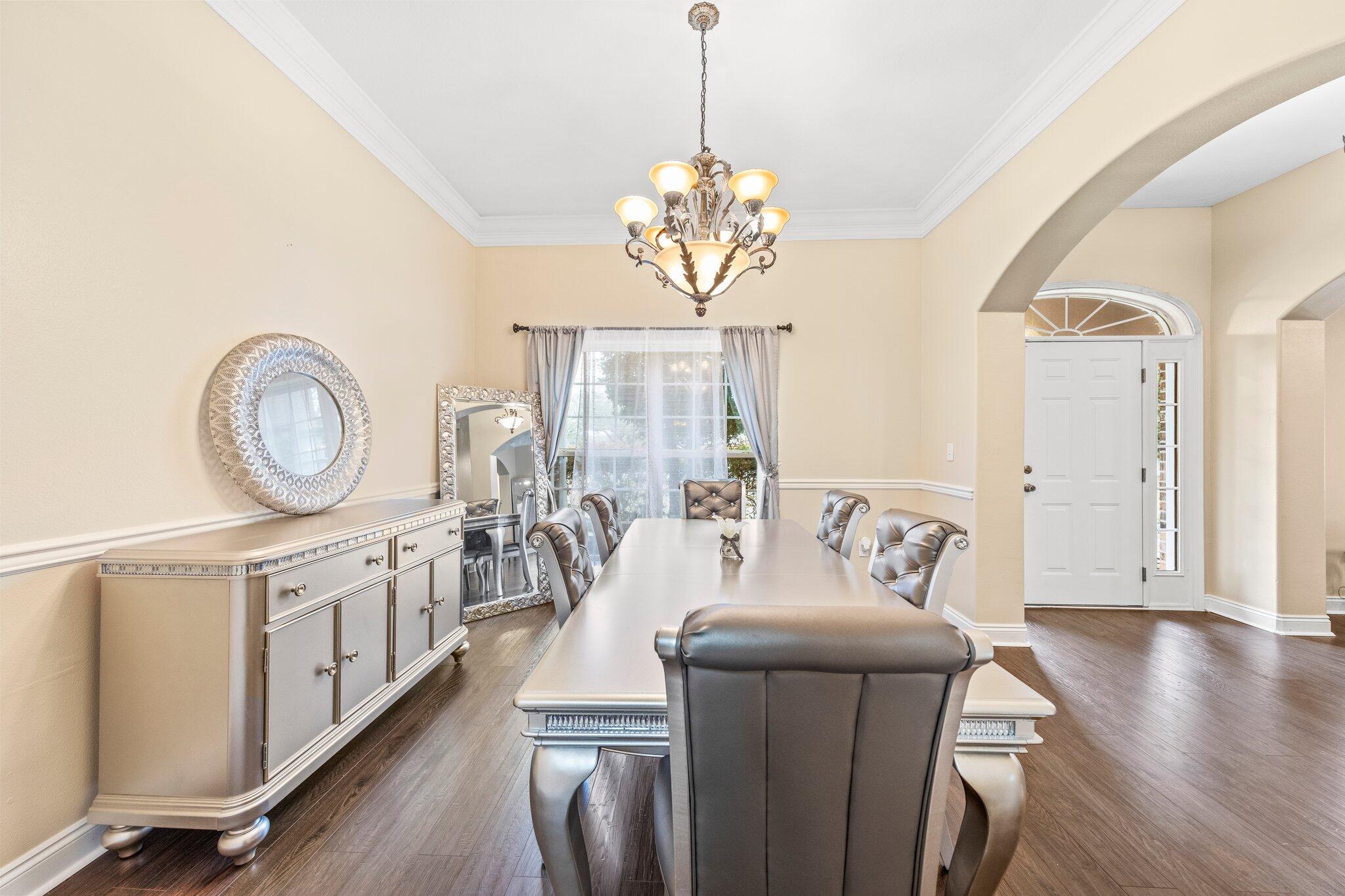 901 Shoal River Drive Crestview, FL 32539 - Photo 17 of 56 a living room with furniture a window entryway and wooden floor