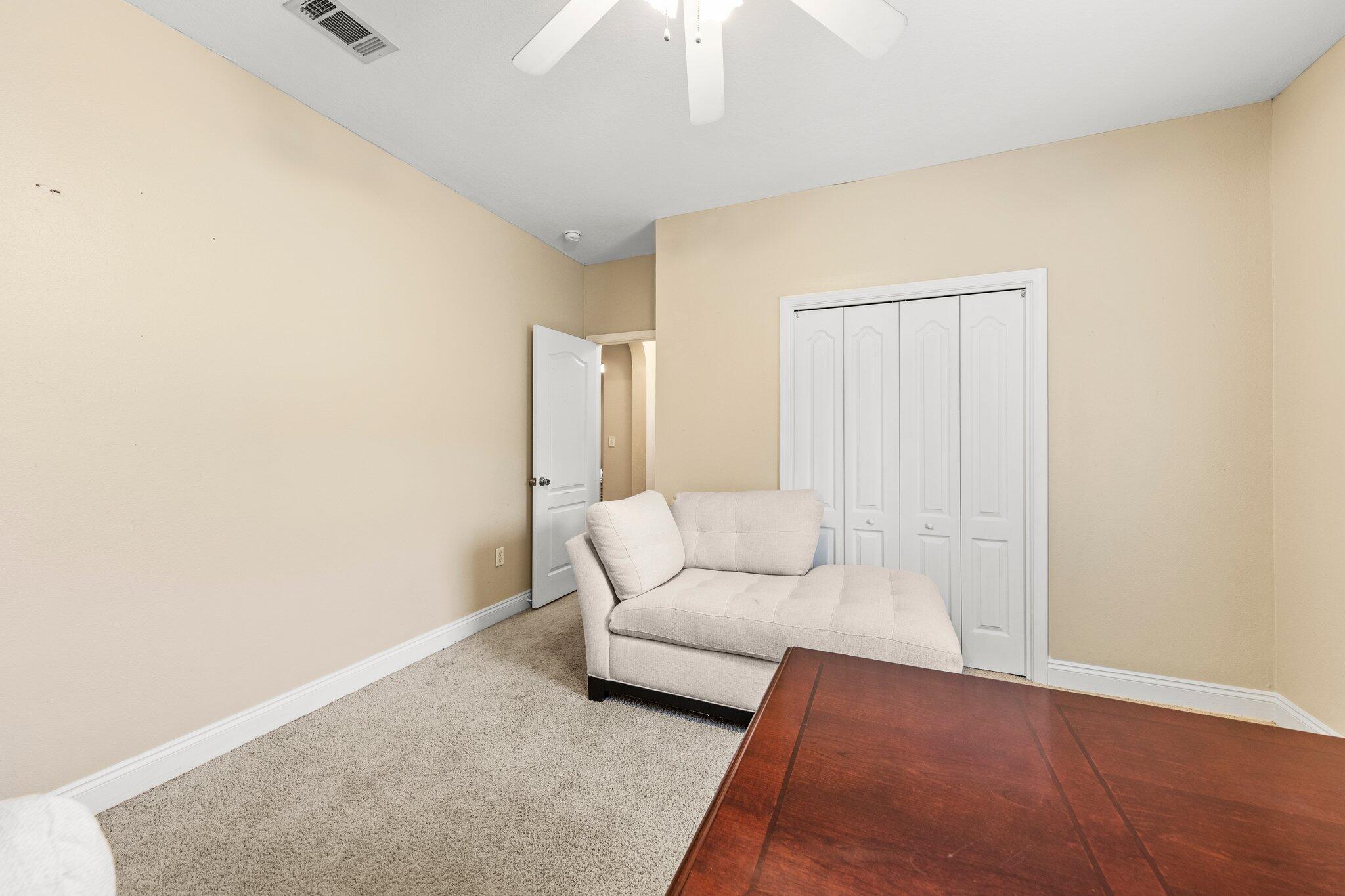 901 Shoal River Drive Crestview, FL 32539 - Photo 23 of 56 a living room with furniture and a lamp