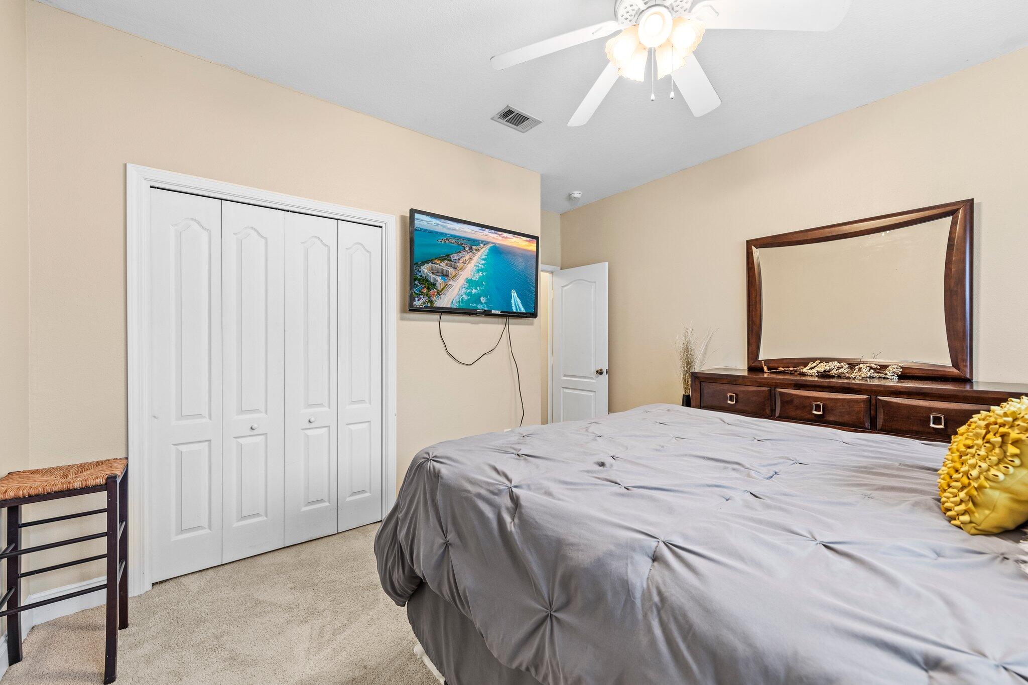 901 Shoal River Drive Crestview, FL 32539 - Photo 27 of 56 a bedroom with a bed and a flat screen tv